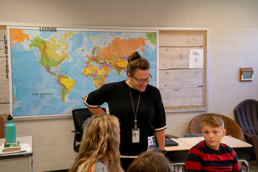 Woman smiling at student