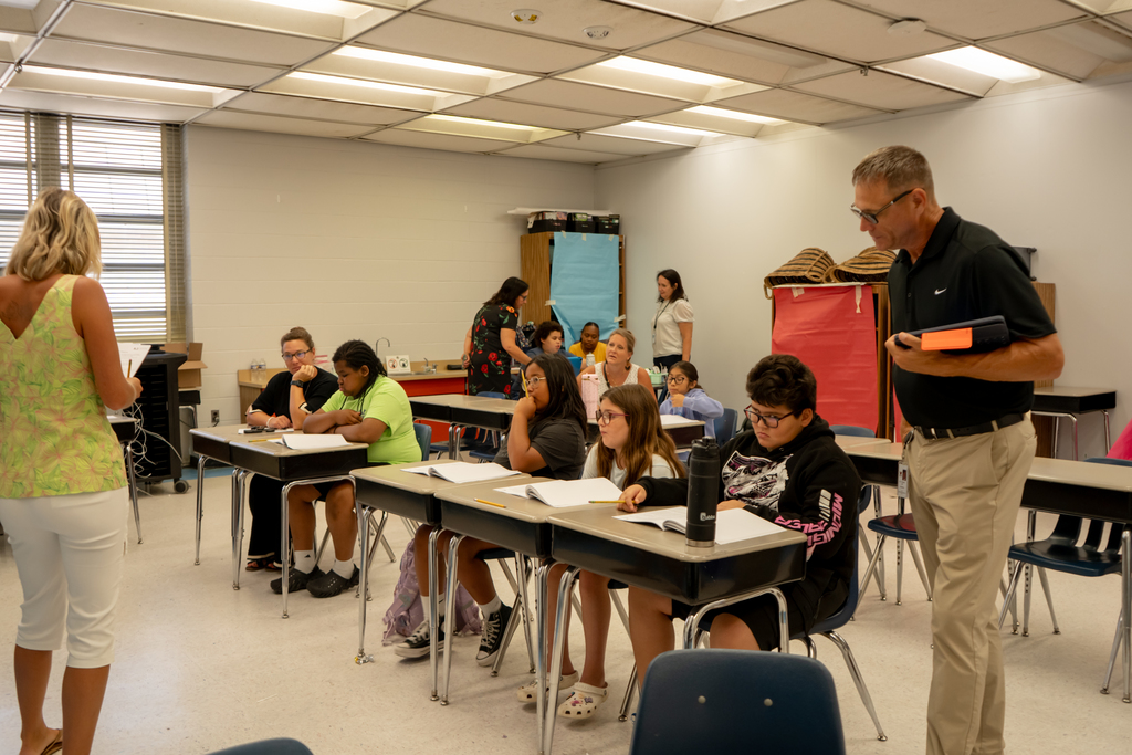 People and students in a classroom