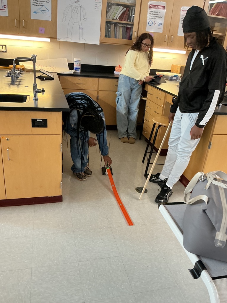 Students launched the cars down ramps and collected the time to determine the speed.  