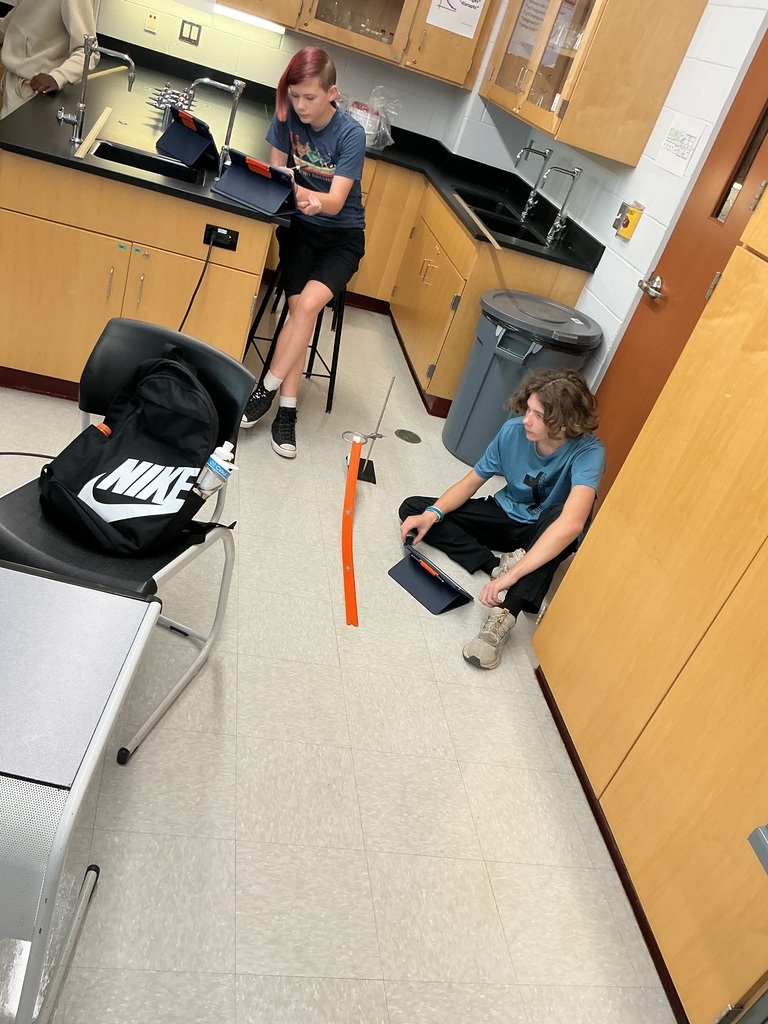 Two students use their iPads to record the data.  
