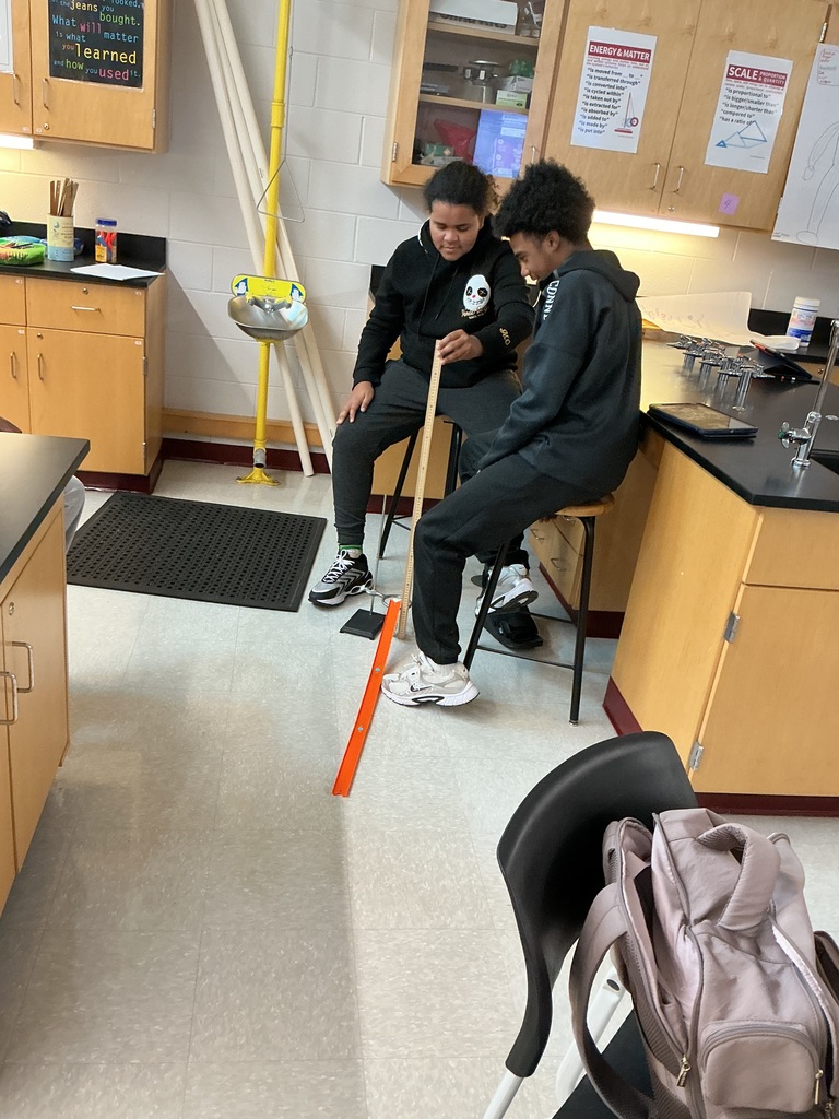 Students used rulers to measure the height of their ramp.  