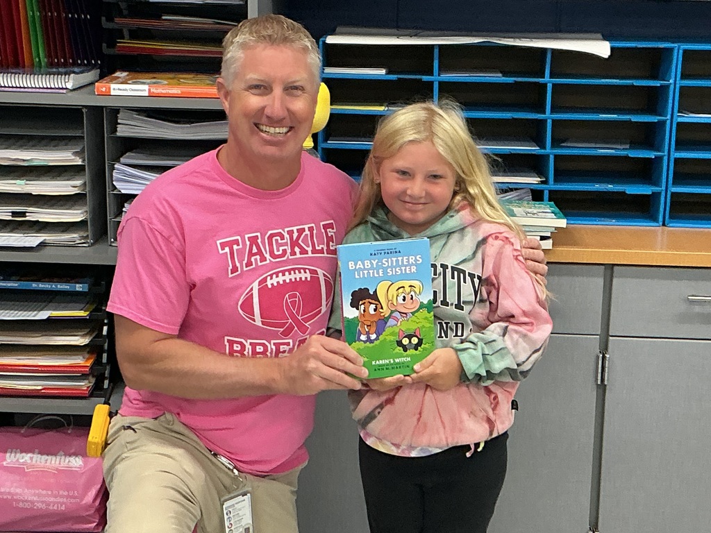 Nora with the book she selected.