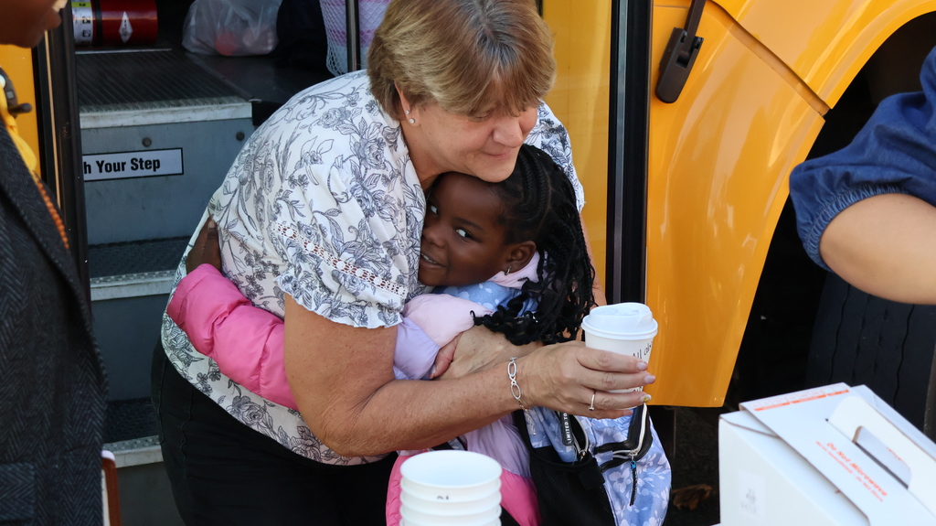 Bus Driver hug with Student