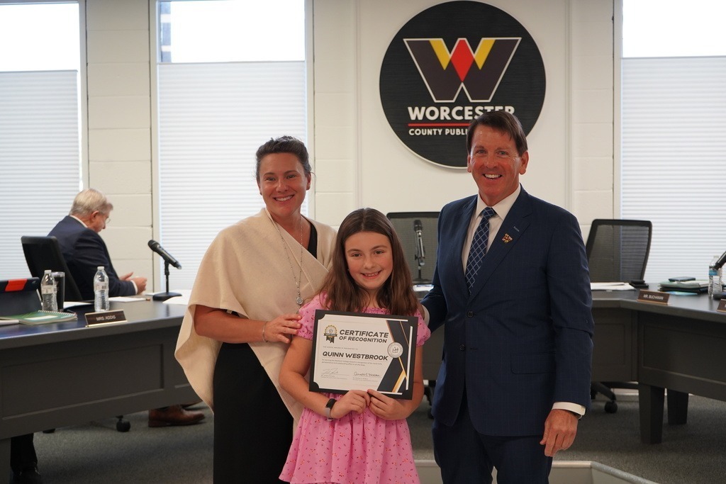 Student receiving Award with Superintendent