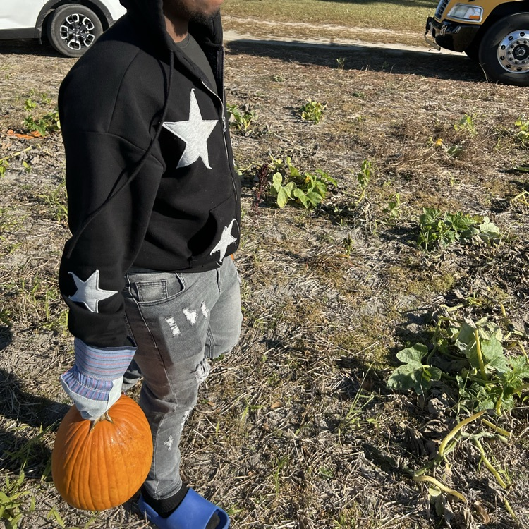 students carrying pumpkins 3