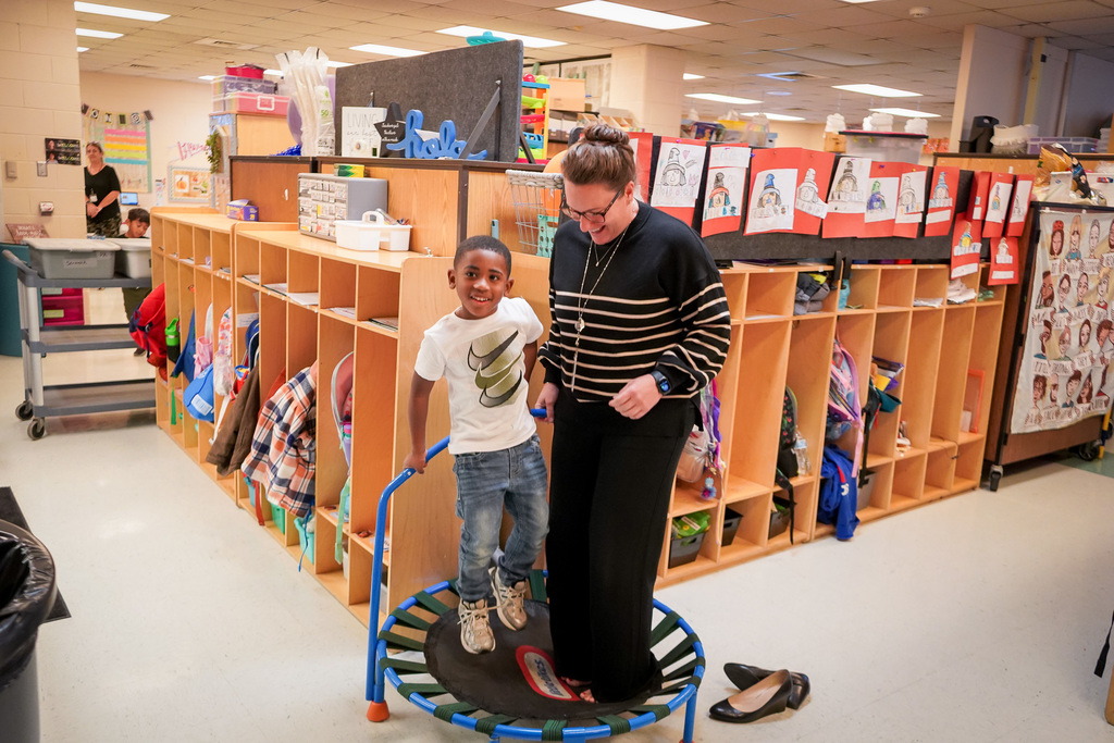 Dr. Wallace jumps with student