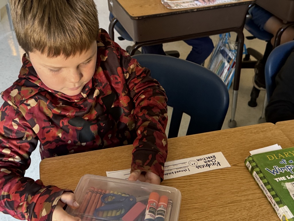 student writing at desk