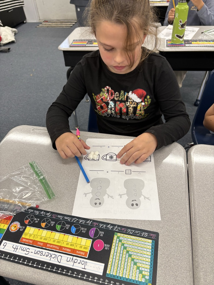 Third graders practice division