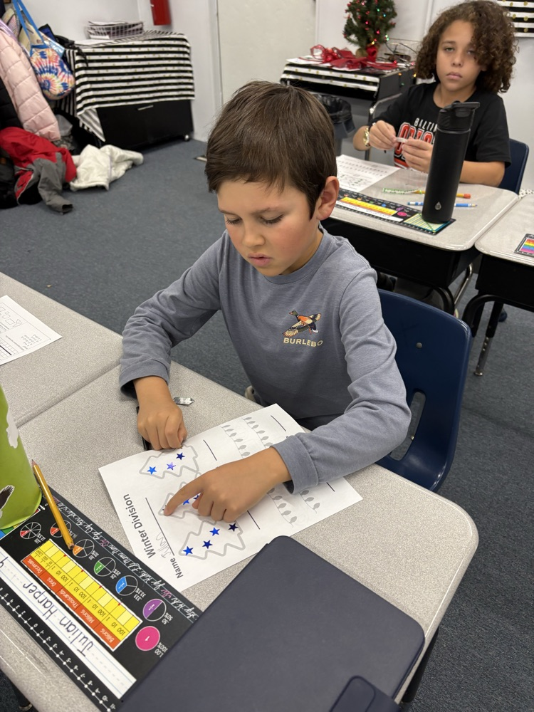 Third graders practice division
