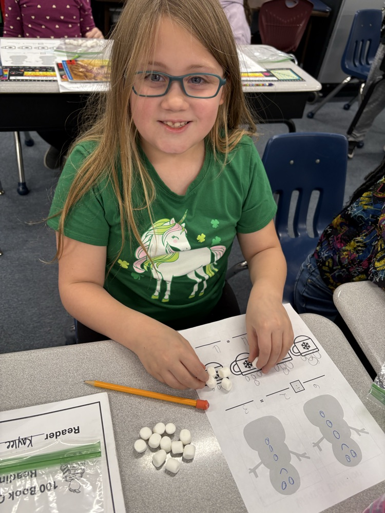 Third graders practice division