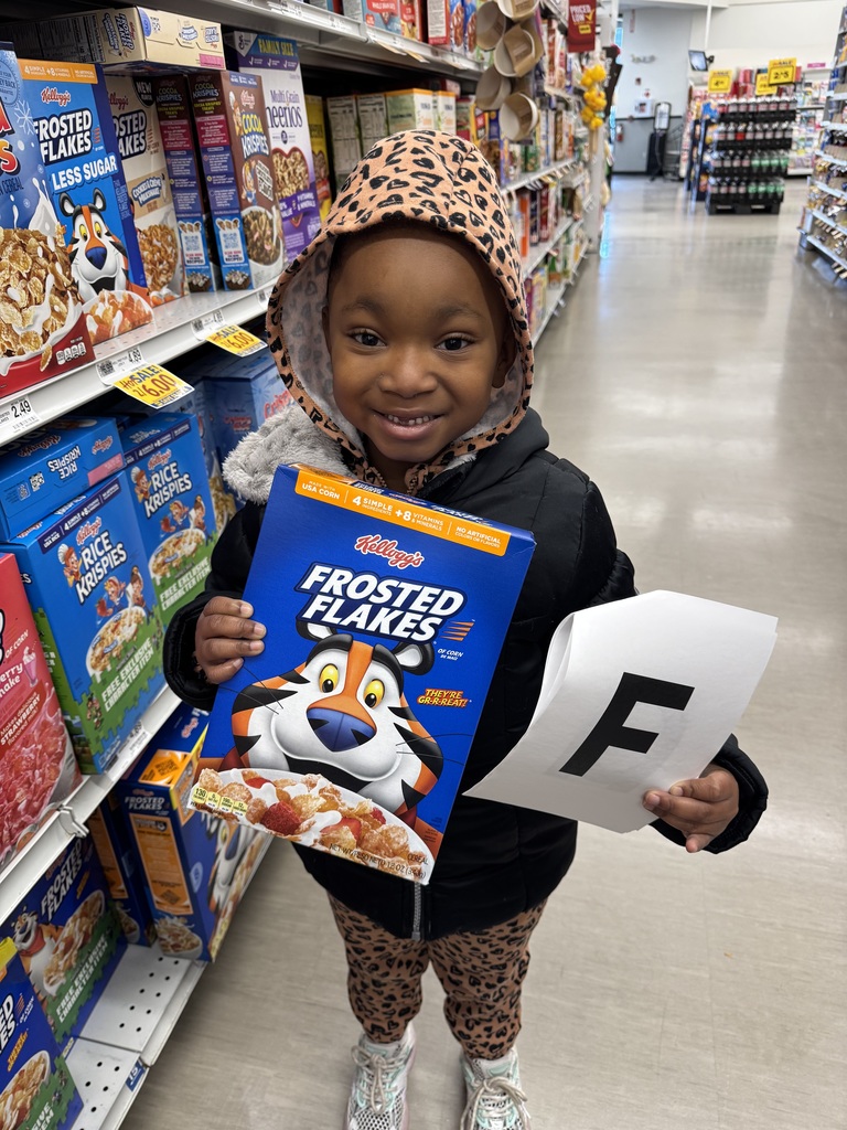 Student holding a box of cereal