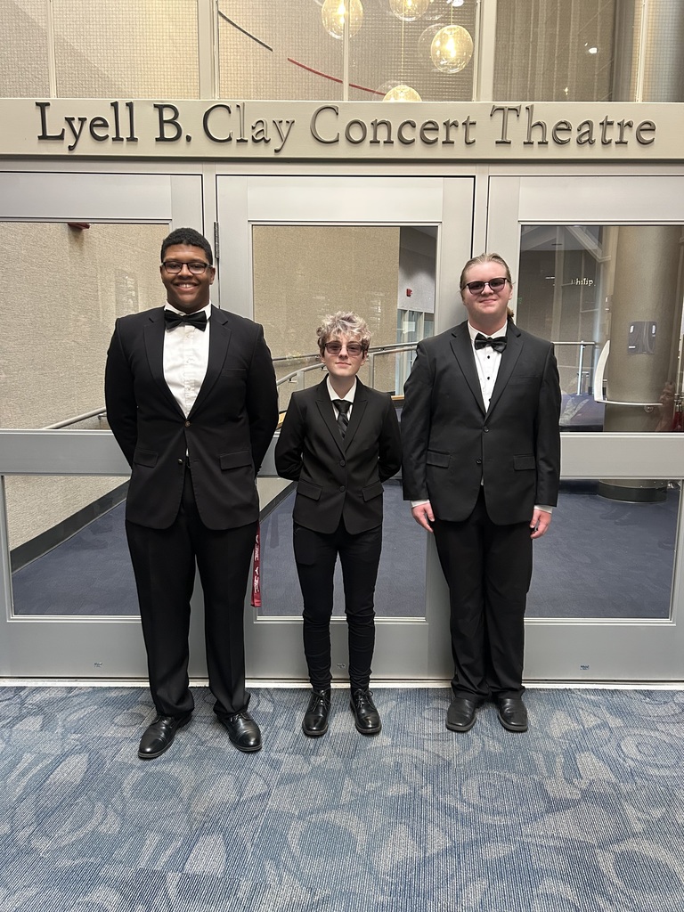 Myles, Oliver, and Alex dressed up before their performance on Saturday