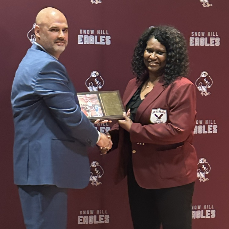 Todd Lampman awarding Myra Sturgis HOF plaque