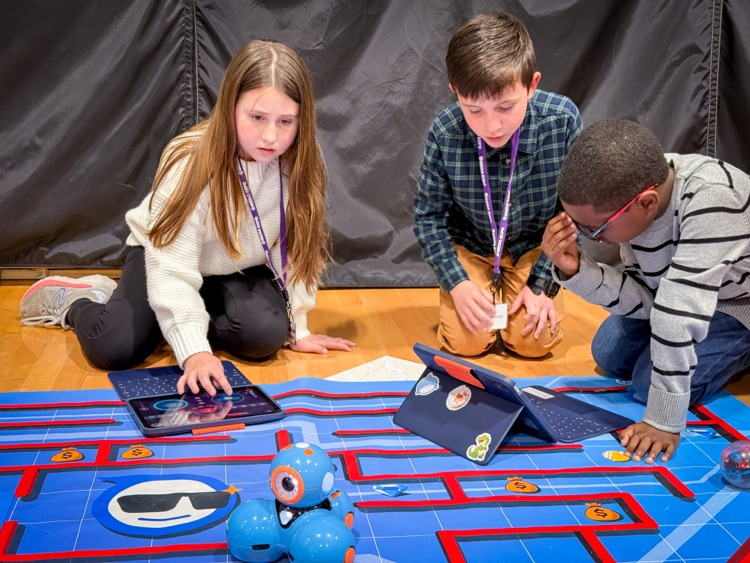 two students using a sphere robot
