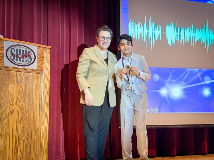 superintendent with award winner