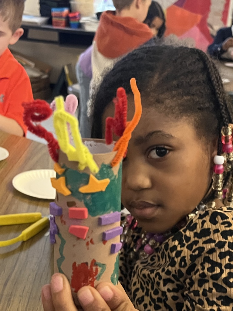 Student showing artwork