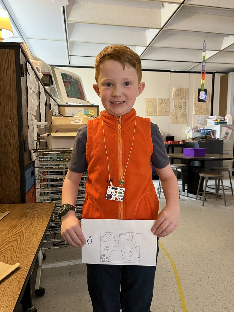 Student showing artwork
