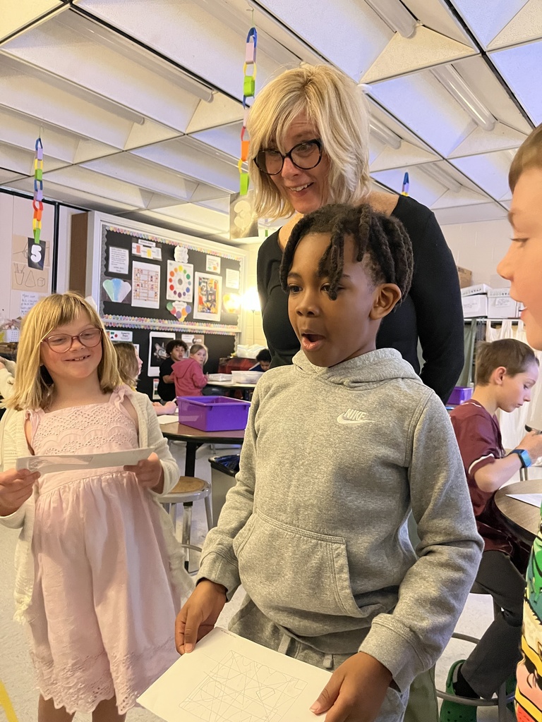 Student showing artwork