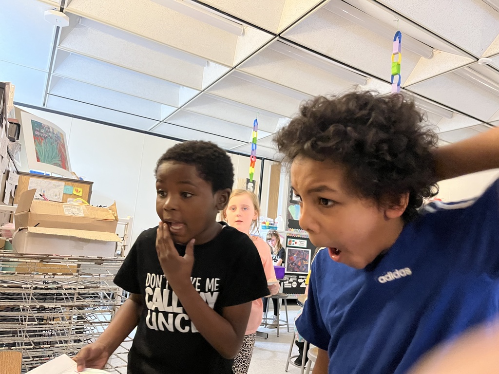 Student showing artwork