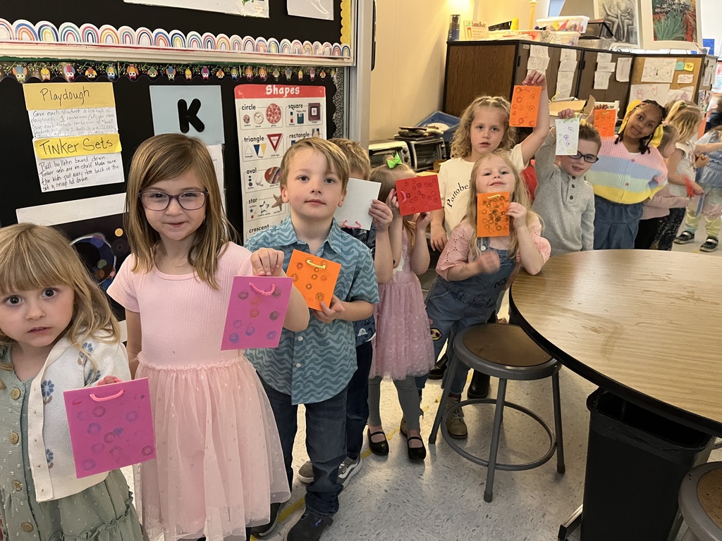 Student showing artwork