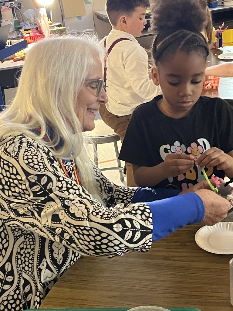 Student showing artwork