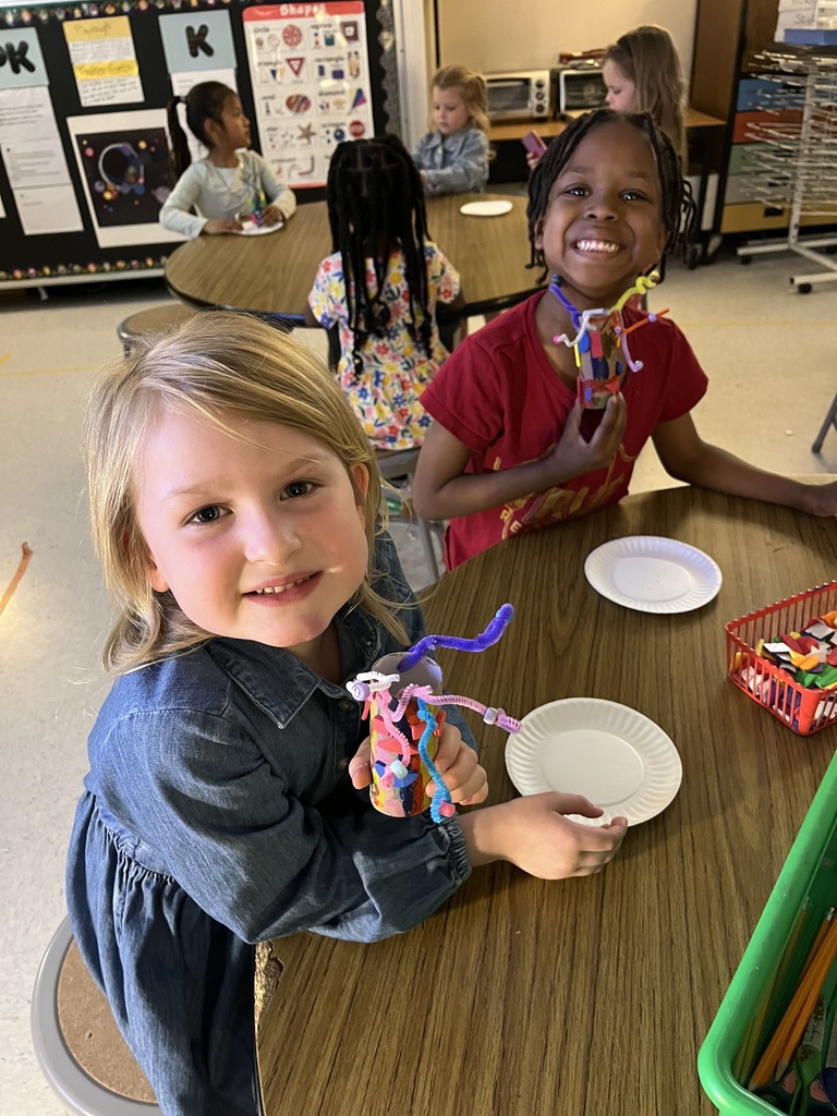 Student showing artwork