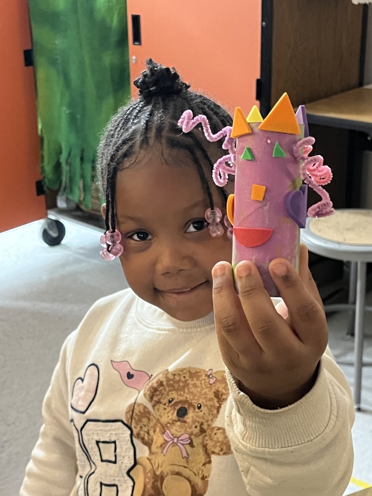 Student showing artwork