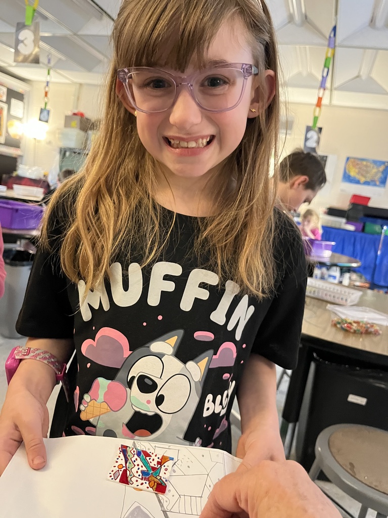 Student showing artwork