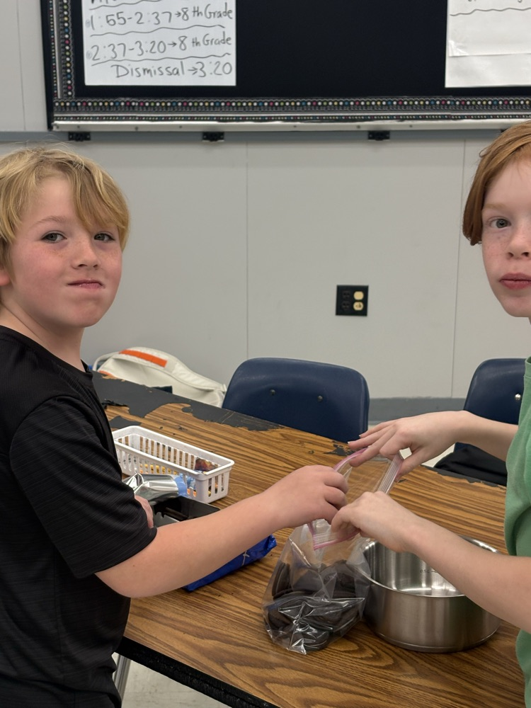 students placing Oreos in bag