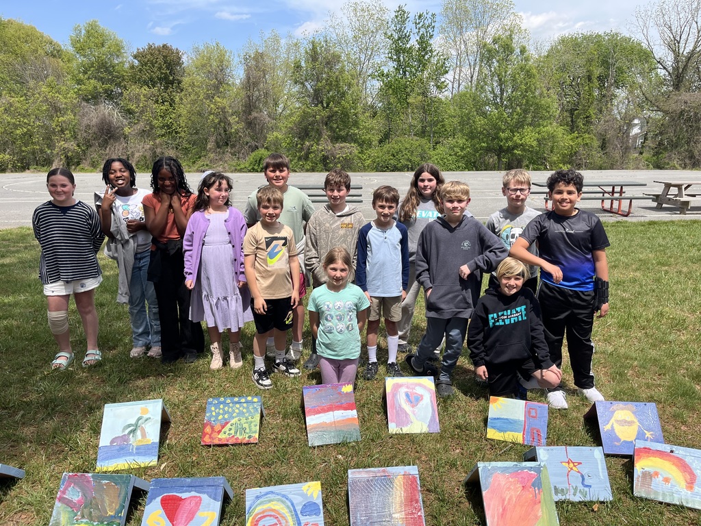Group picture with student painted bird houses