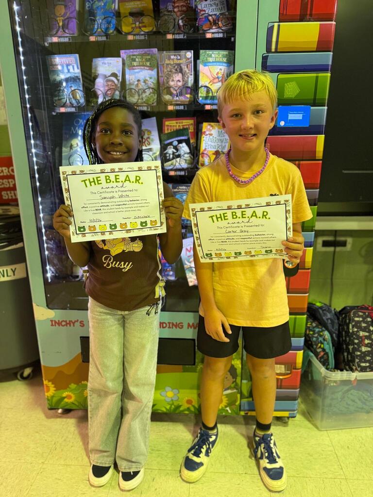 Student holding Certificate