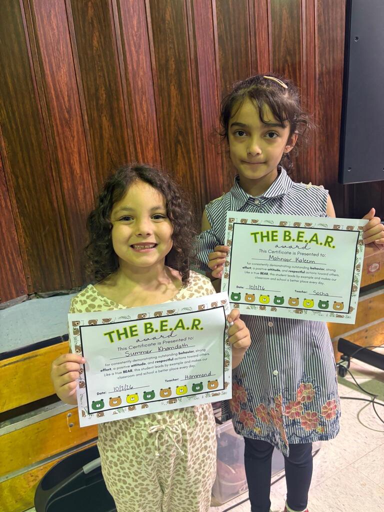 Student holding Certificate