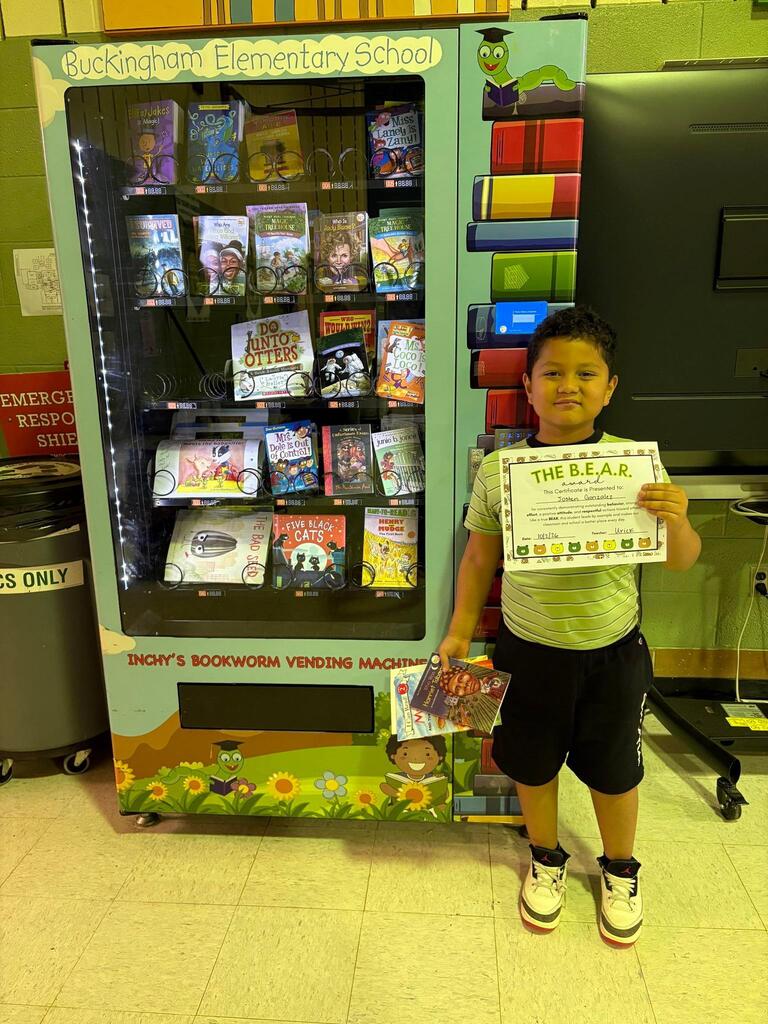 Student holding Certificate