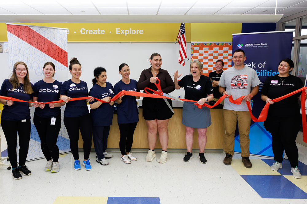 Volunteers from AbbVie, Heart of America and Worcester Public Schools cut the ribbon on the new STEAM classroom at Norrback.