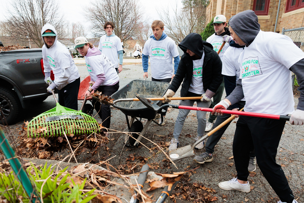 Volunteers from Holy Cross complete landscaping at Heard Street.