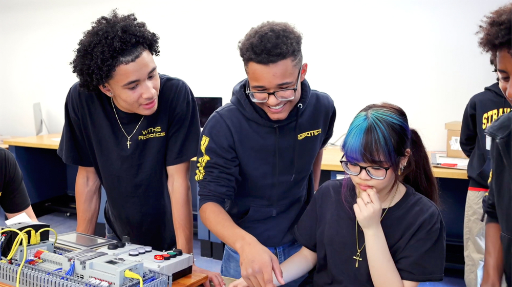 Students work together during Exhibition Day.