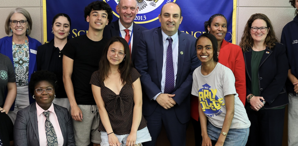 Zrike with students and officials