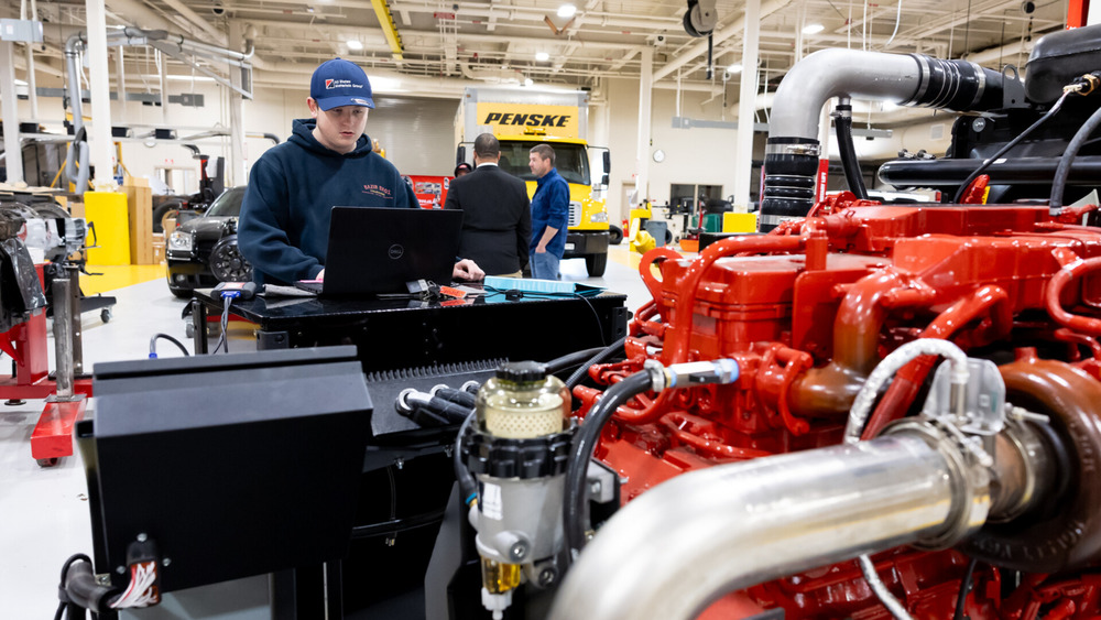 A student in the Adult Diesel Technology Program works with a diesel engine.