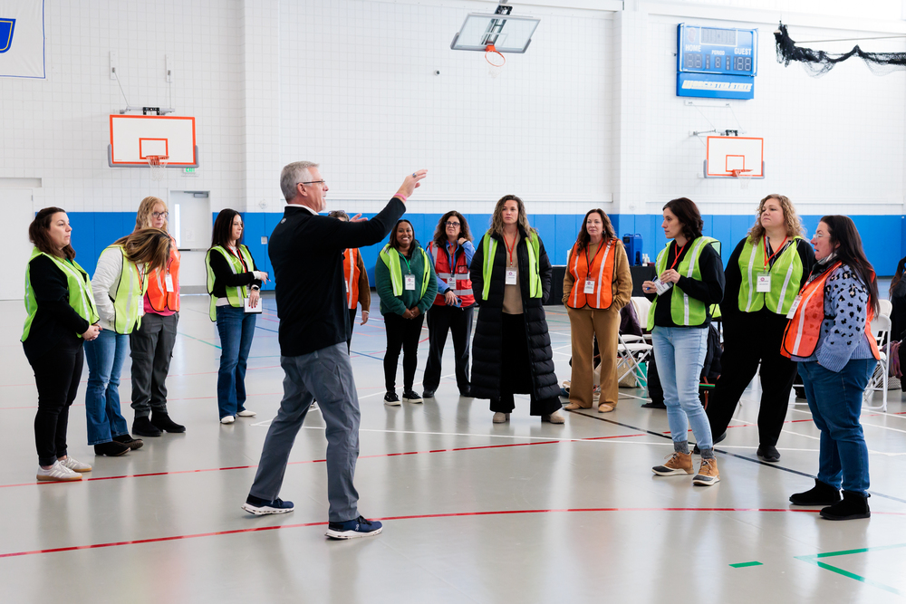 A large group of WPS staff in safety vests during a recent safety training session.