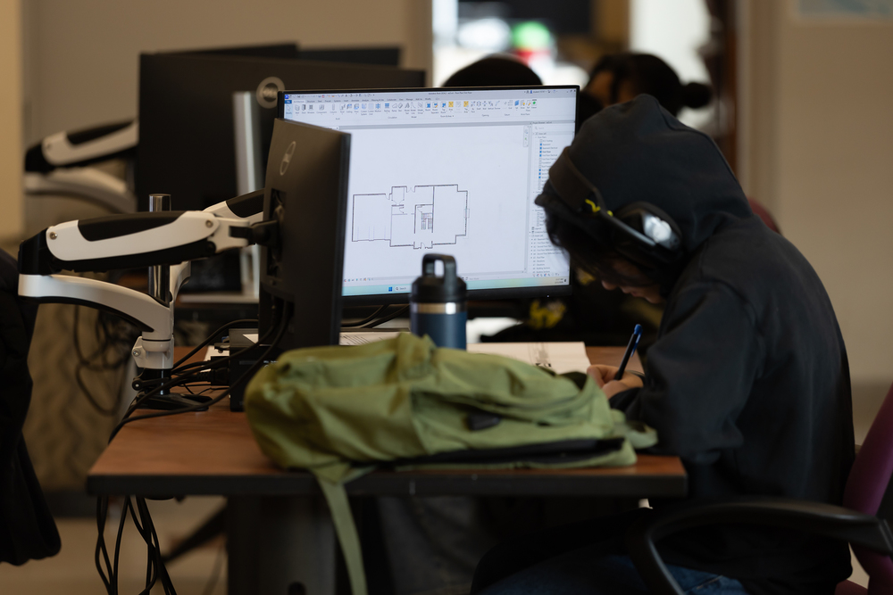 A student conducting drafting work on a computer