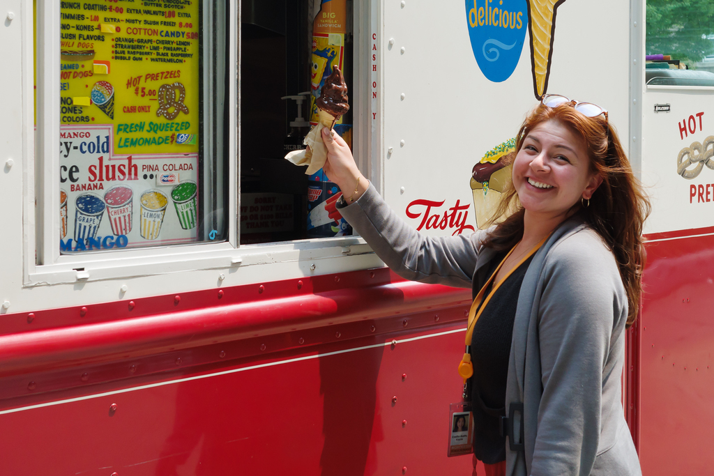 A WPS staff member gets ice cream from an ice cream truck.