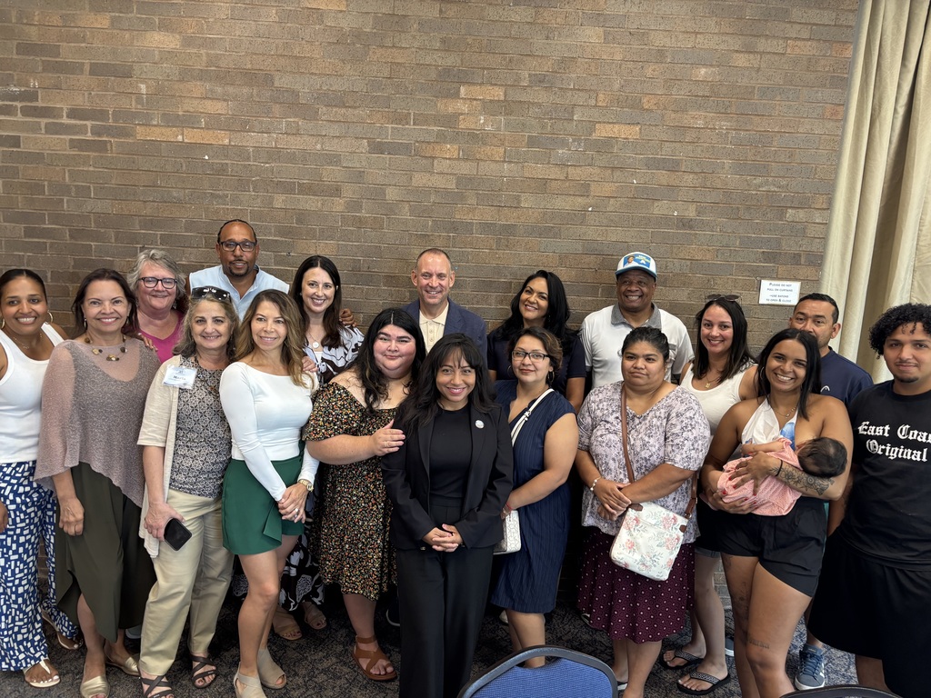A group photo with 19 people who attended the event, including Superintendent Allen