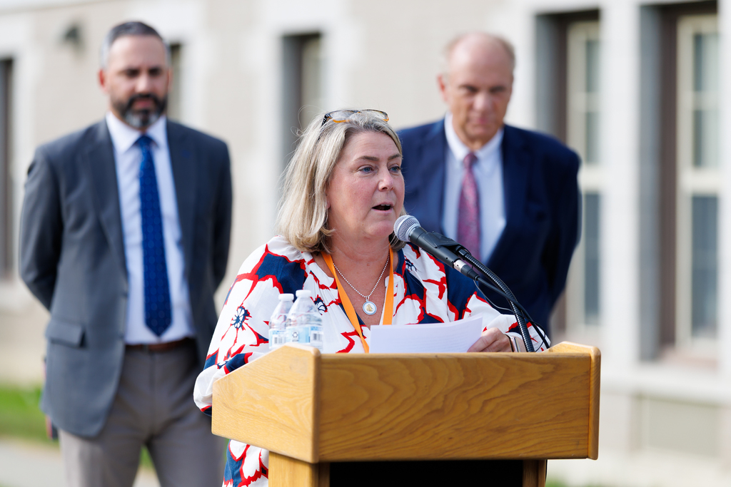 Roosevelt School Principal Maureen Power speaks at the podium. 