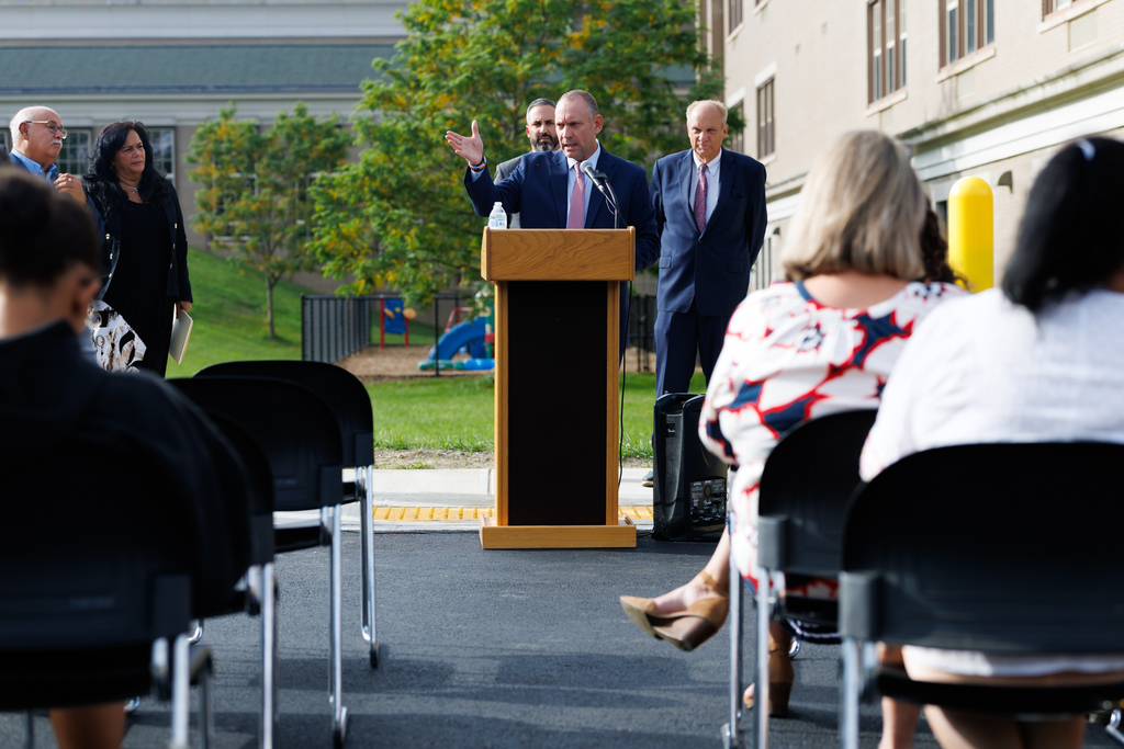 Superintendent Brian E. Allen speaks at the podium.