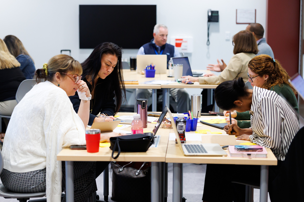 Principals and district administration collaborate during a Spark Leadership Academy meeting.