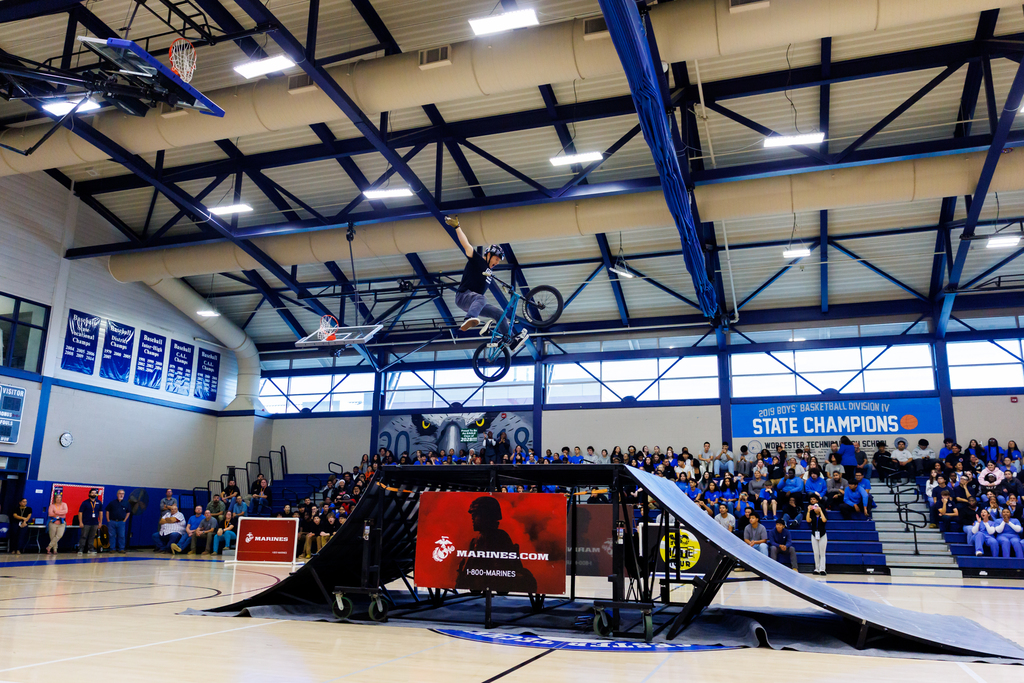 A BMX biker leaps over a ramp during an event at Worcester Tech.