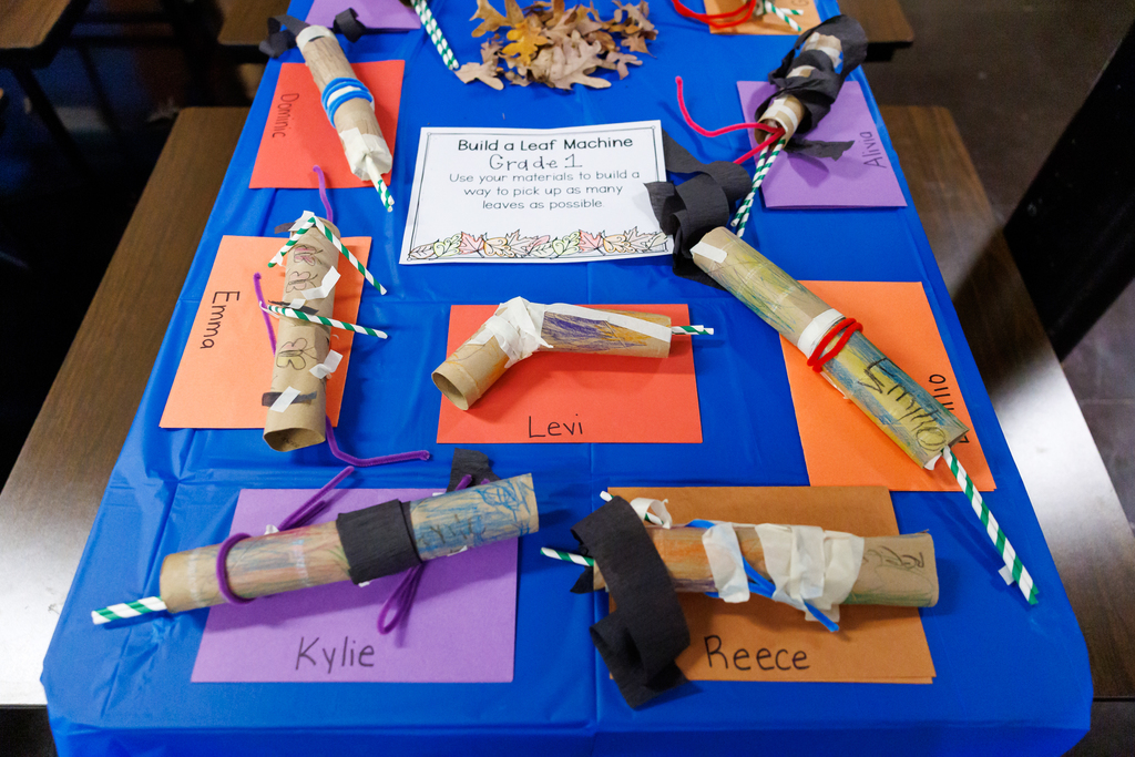 Student projects displayed on a table during a STEAM Showcase at Lake View.