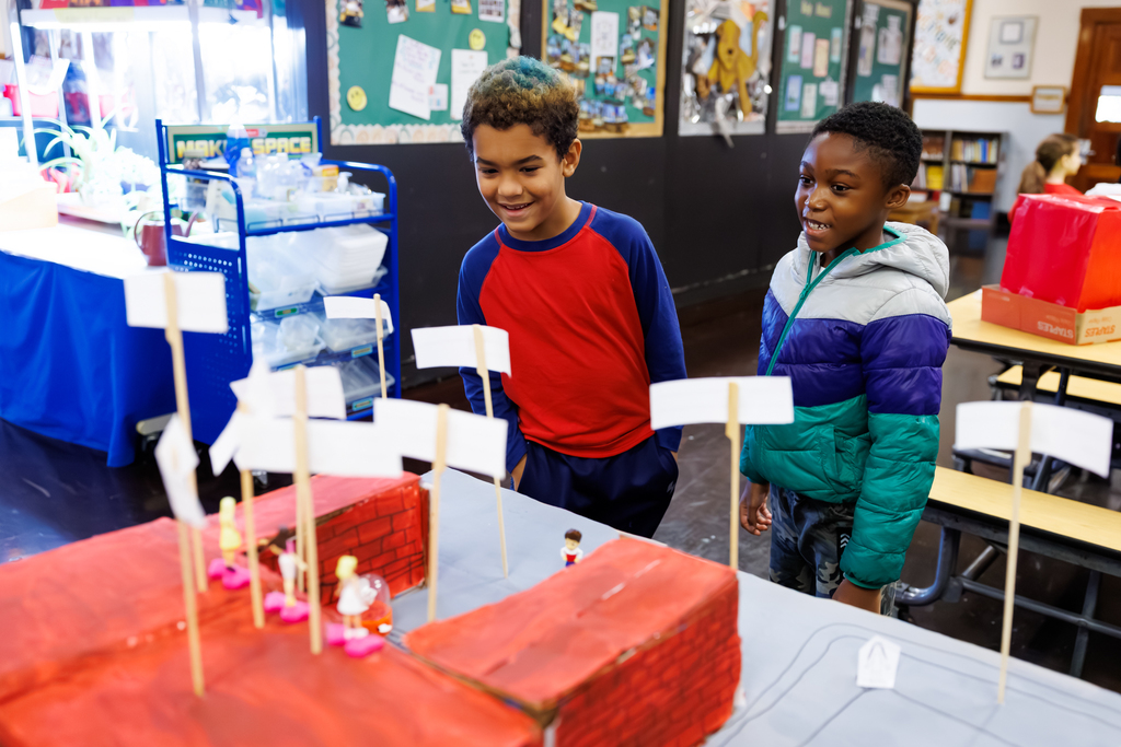 Two students engage with a project during a STEAM Showcase at Lake View.