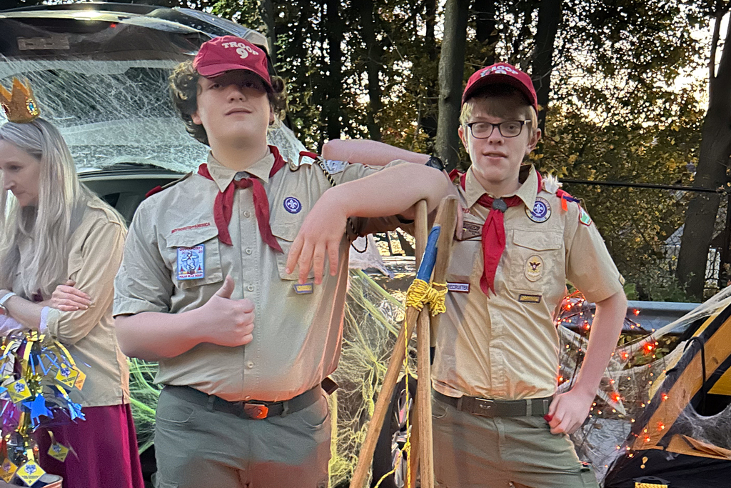 Two students dressed as boy scouts during a Trunk or Treat.