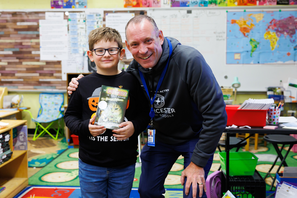 Superintendent Allen stands with second grader Sullivan Raposa.